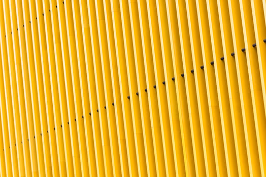 Detail of yellow metal building facade photo