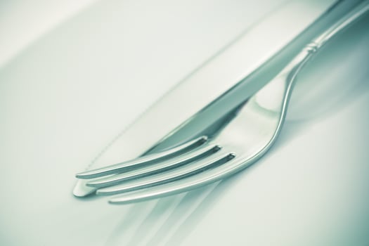 Fork and knife on a white background photo