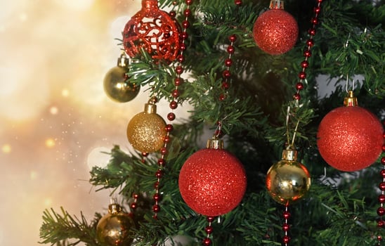 Christmas card with toys, fir branches and a garland.Decor with sweets, cinnamon. photo