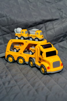 a toy truck with a trailer on it photo