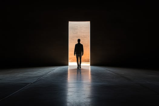 A man standing in front of an open door photo
