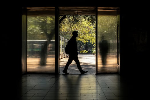 A man walking through a doorway photo