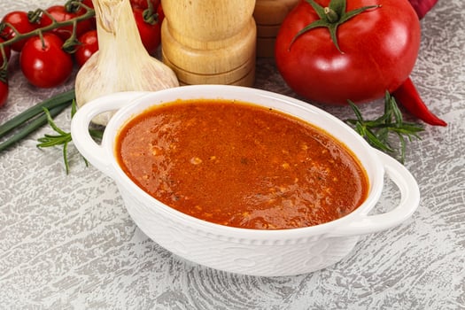 Hot tomato soup with diced chicken photo