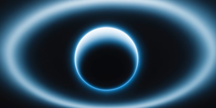 A blue planet with a large blue circle in the middle photo
