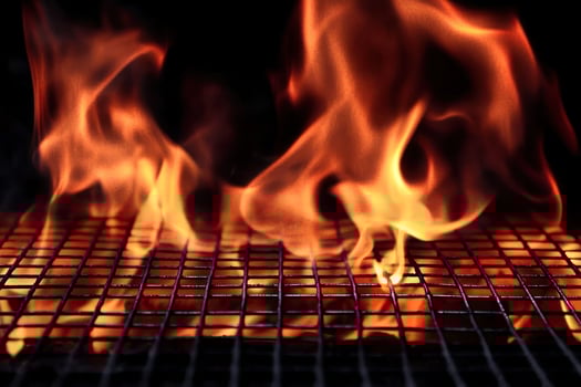 Fiery BBQ Grill Flames Hot Coal Briquettes Cooking Fire photo