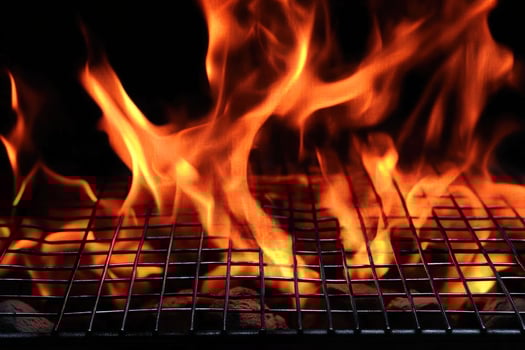 Fiery BBQ Grill Hot Coal Burning Flames Summer Cookout photo