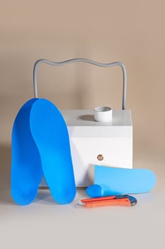Orthopedic insoles for shoes on a colour background. Foot care photo