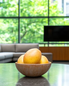 fresh pears in a wooden bowl on a table with a green background photo