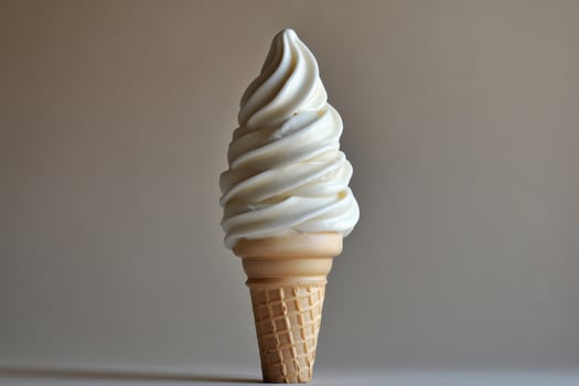 A Single Soft Serve Ice Cream Cone photo