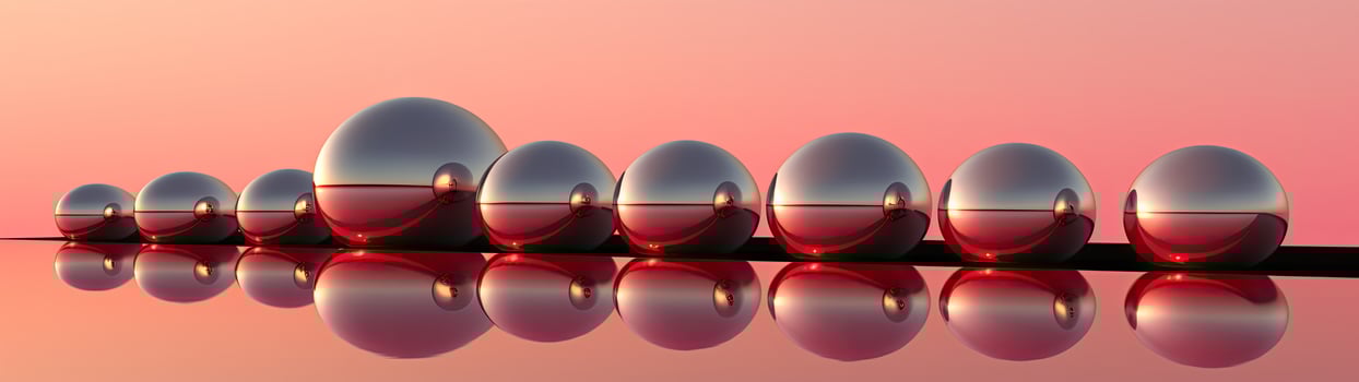 Reflective glass spheres on a vibrant background photo