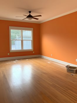 Bright and airy living room with hardwood floors and ceiling fan photo