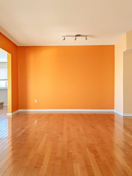 empty room with orange walls and hardwood floors photo