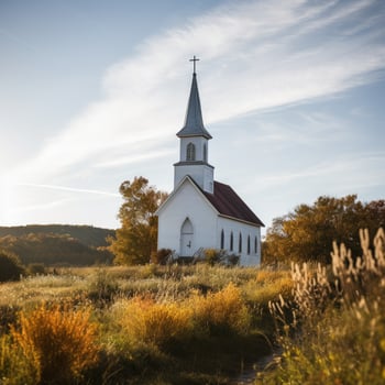 Picturesque rural church in autumn landscape photo