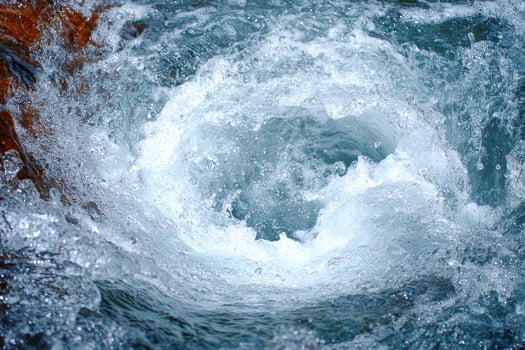 Rushing waterfall with splashing water photo