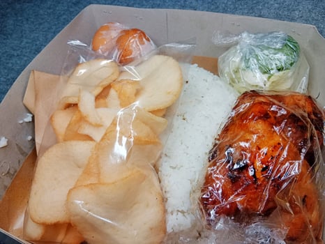 Classic Indonesian Rice Box with Grilled Chicken and Crispy Potato photo