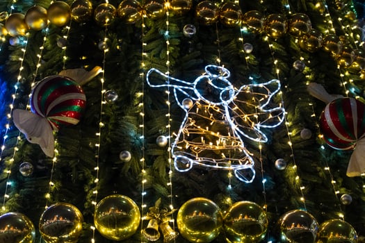 Christmas decorations on the Christmas tree. An angel singing on a trumpet photo