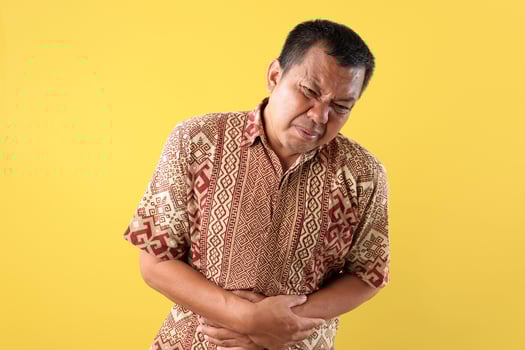 Portrait of Asian Middle Age Man, Hand in Stomach, Suffering Stomach Ache photo