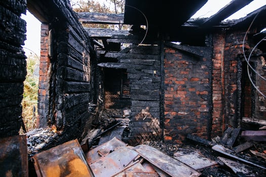 Aftermath of fire. Completely burnt house interior.... photo