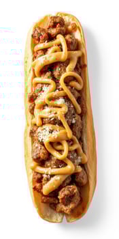 Savory meatball sub loaded with cheese sauce and herbs on a fresh bun photo