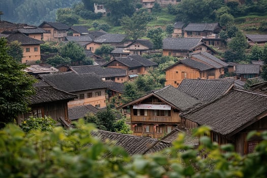 Hillside village with traditional houses and lush greenery. photo
