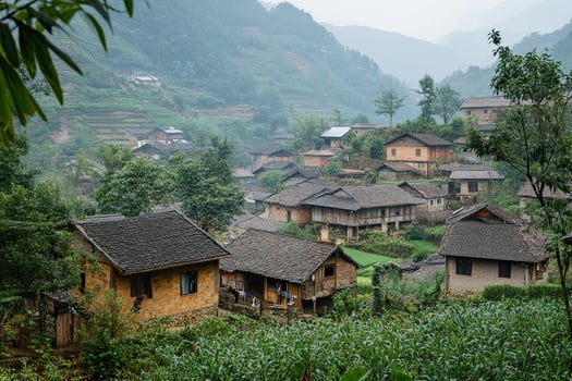 Misty mountain village with traditional houses and terraced fields. photo
