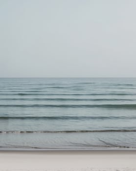 Peaceful Shoreline with Blue Ocean Waves Background photo