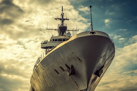 A large ship under a cloudy sky, showcasing its structure. photo