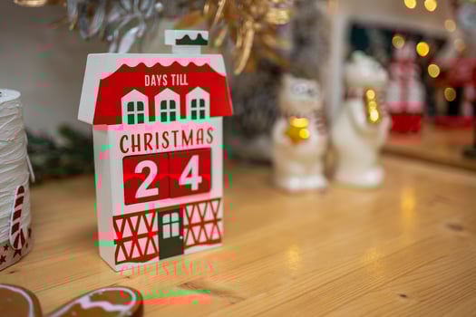 Christmas composition on the shelf in the kitchen interior. Beautiful decoration. Christmas trees, light and accessories. Merry Christmas and Happy Holidays. High quality photo