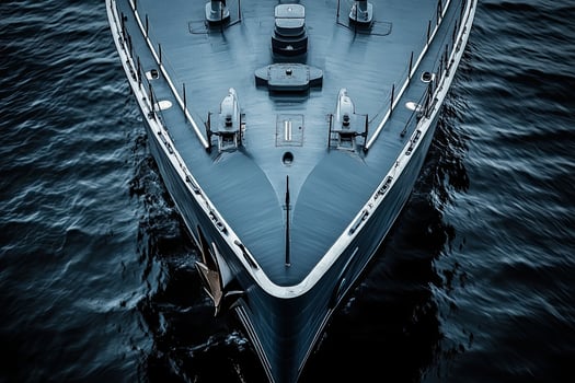 Aerial view of a sleek yacht on calm waters. photo