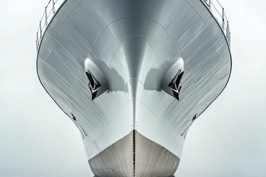 Close-up of a ship's bow against a cloudy background. photo