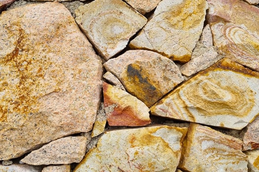 Textured Pattern of Natural Stone Wall for Architectural Design and Decoration photo