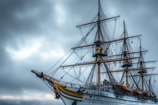 Historic sailing ship under cloudy sky. photo