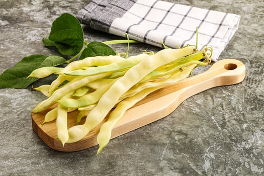 Raw green bean strings heap photo