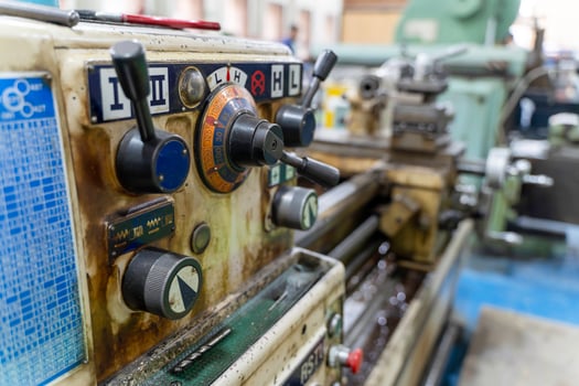 Closeup old model lathe and drilling machine in industrial. photo