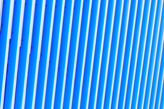 Detail of blue striped metal facade for background photo