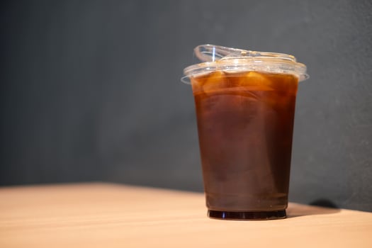 Ice black coffee in takeaway cup. photo