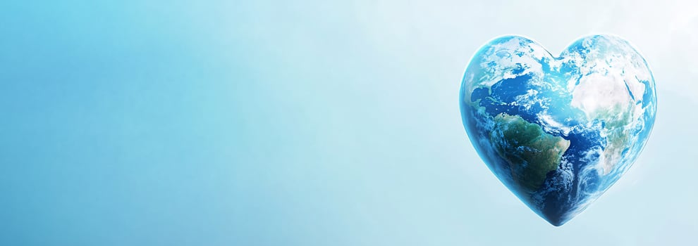 Earth in heart shape with blue sky photo