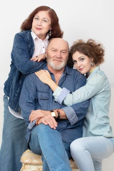 Family portrait of an adult daughter and elderly parents photo