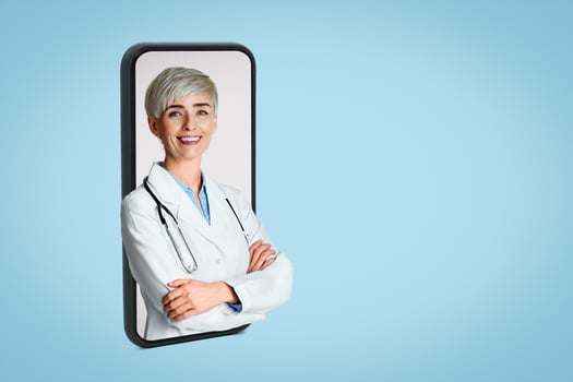 Professional concept. Portrait of smiling young woman doctor in white coat with stethoscope, isolated over light background photo