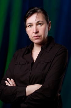 Studio portrait of a middle-aged brunette woman forty years old. photo