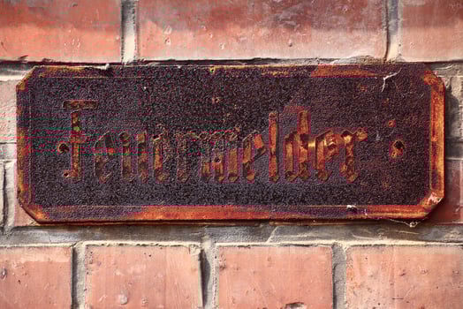 Historic rusty sign with the German word Feuermelder - fire alarm photo