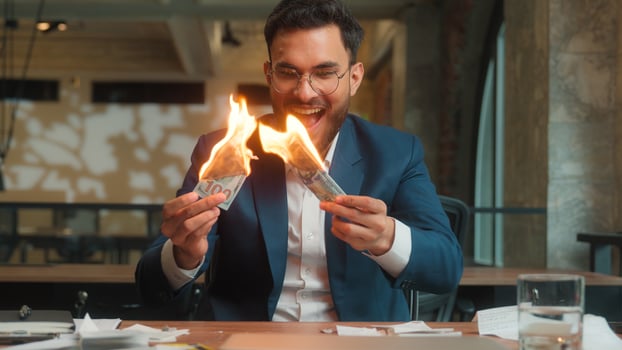 Happy male Arabian Indian business man crazy mad laughing guy joyful excited businessman office investor rejoicing fooling burn money dollars waste finance cash salary enjoy burning banknotes have fun photo