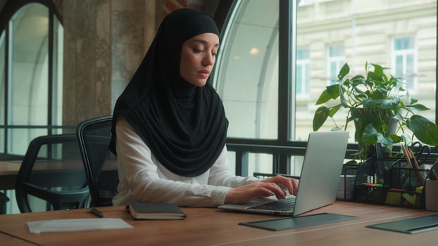 Thinking muslim islamic woman pensive sad upset girl in hijab female office worker businesswoman employee student pc laptop studying online work distant e-learning computer typing think problem ponder photo