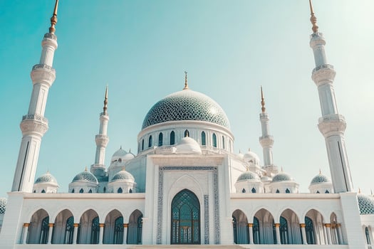 Majestic white mosque under a clear blue sky. photo