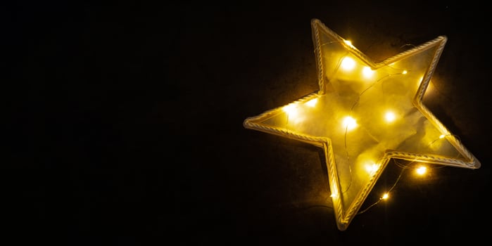 Christmas star ice cream sticks handmade Storytelling creating craft Christmas holiday decoration. Tactile hand-on activity. Master class progress of creative me-made gifts. Seasonal domestic life micro moment hobby. Sustainable living photo