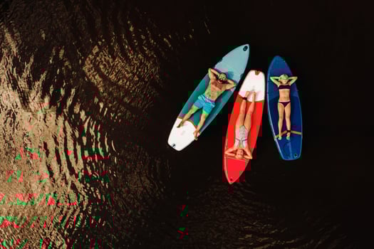 Family spend time together relaxing on sup boards on the lake photo