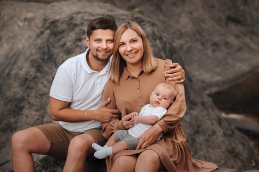 Happy family of three in the summer in the park in nature photo