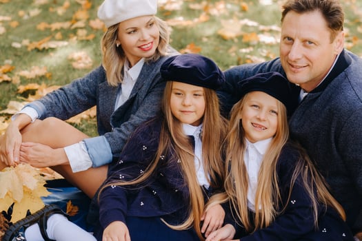 A big family on a picnic in the fall in a nature park. Happy people in the autumn park photo
