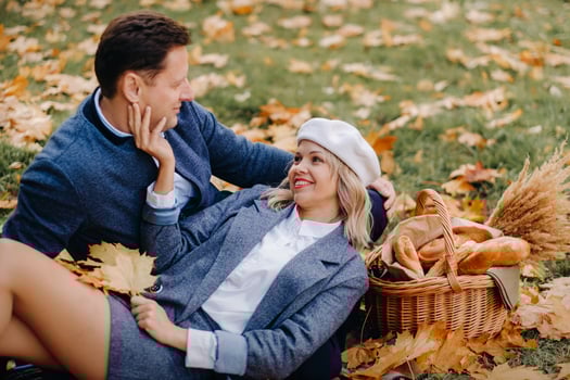 Happy couple enjoying golden autumn spring season in the park photo