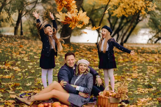 A big family on a picnic in the fall in a nature park. Happy people in the autumn park photo